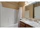Bathroom featuring granite countertops, a bathtub and a tiled shower at 18017 W Desert Ln, Surprise, AZ 85388