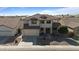 Inviting two-story home with a two-car garage and desert landscaping at 18017 W Desert Ln, Surprise, AZ 85388