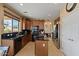 Well-lit kitchen featuring dark countertops, stainless steel appliances, and a functional center island at 18017 W Desert Ln, Surprise, AZ 85388