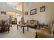 The expansive living area features soaring ceilings and lots of natural light from clerestory windows at 18017 W Desert Ln, Surprise, AZ 85388