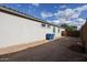 Exterior view of the home's side yard with trash bins at 19134 W Madison St, Buckeye, AZ 85326