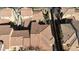 Aerial view of a residential community featuring terracotta tile roofs and mature landscaping at 21134 W Sunrise Ln, Buckeye, AZ 85396