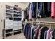 Organized walk-in closet with shelving, drawers, and hanging racks for optimal storage at 21134 W Sunrise Ln, Buckeye, AZ 85396