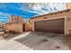 View of a house with a brown garage door and drought-tolerant landscaping at 21134 W Sunrise Ln, Buckeye, AZ 85396