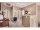 Upstairs hallway with neutral carpet, a small table and decor at 21134 W Sunrise Ln, Buckeye, AZ 85396