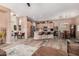 Open floor plan showcasing the kitchen with island seating connected to the living area and dining space at 21134 W Sunrise Ln, Buckeye, AZ 85396