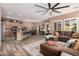 Open living area with hardwood floors connecting the living room, kitchen, and dining area at 21134 W Sunrise Ln, Buckeye, AZ 85396