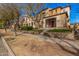 Charming street view showcasing well-maintained homes, sidewalks, trees, and grassy front yards at 21134 W Sunrise Ln, Buckeye, AZ 85396