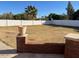 Large backyard with a red brick wall, perfect for outdoor activities and relaxation at 2222 N Val Vista Dr # 2, Mesa, AZ 85213