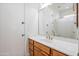 Bathroom featuring single sink, wooden cabinets, and large mirror at 2222 N Val Vista Dr # 2, Mesa, AZ 85213