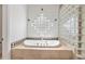 Elegant bathtub with glass block window and diamond pattern at 2222 N Val Vista Dr # 2, Mesa, AZ 85213