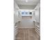Walk-in closet with built-in shelving and ample storage at 2222 N Val Vista Dr # 2, Mesa, AZ 85213