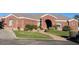 Expansive brick home featuring an arched entryway, manicured lawn, and mature landscaping at 2222 N Val Vista Dr # 2, Mesa, AZ 85213