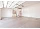 Bright garage with epoxy flooring, overhead door and storage at 2222 N Val Vista Dr # 2, Mesa, AZ 85213