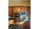 Well-equipped kitchen showcasing stainless steel appliances and custom cabinets at 2222 N Val Vista Dr # 2, Mesa, AZ 85213