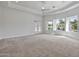 Spacious living area with large windows and glass doors allowing for plenty of natural light at 2222 N Val Vista Dr # 2, Mesa, AZ 85213