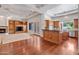 Open floor plan with built-ins and a view into the kitchen at 2222 N Val Vista Dr # 2, Mesa, AZ 85213