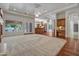 Open-concept living area with hardwood flooring and view of the kitchen at 2222 N Val Vista Dr # 2, Mesa, AZ 85213