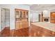 Inviting living room with hardwood floors, built-in cabinets, fireplace, and ample natural light at 2222 N Val Vista Dr # 2, Mesa, AZ 85213