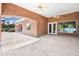 Covered patio with brick columns, ceiling fans, and views of the well manicured backyard at 2222 N Val Vista Dr # 2, Mesa, AZ 85213