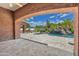 Stunning pool area features a rock waterfall, slide and an intricate brick archway framing the lush backyard at 2222 N Val Vista Dr # 2, Mesa, AZ 85213