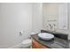 Elegant powder room featuring a modern vessel sink on a granite countertop and stylish mirror at 2222 N Val Vista Dr # 2, Mesa, AZ 85213