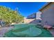 Enjoy your putting green in this backyard at 23306 S 221St St, Queen Creek, AZ 85142