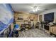 Bedroom with wood-like accent wall and ceiling fan at 23306 S 221St St, Queen Creek, AZ 85142