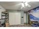 Bedroom with mountain mural and double door closet at 23306 S 221St St, Queen Creek, AZ 85142