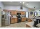 Kitchen with stainless steel appliances and wood cabinets at 23306 S 221St St, Queen Creek, AZ 85142