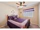 Charming bedroom with ceiling fan and window coverings at 25746 W Hess Ave, Buckeye, AZ 85326