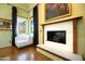 Bright living room featuring a fireplace and large windows at 33 W Lynwood St, Phoenix, AZ 85003