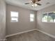 Cozy bedroom with natural light, wood-look flooring, and ceiling fan at 358 N 82Nd Way, Mesa, AZ 85207