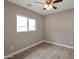 Bright bedroom with ample natural light, ceiling fan, and neutral color palette at 358 N 82Nd Way, Mesa, AZ 85207