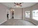 Open bedroom with natural light, wood-look flooring, and easy access to bathroom at 358 N 82Nd Way, Mesa, AZ 85207