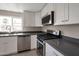 Updated kitchen with stainless steel appliances, granite countertops, and bright, updated windows at 358 N 82Nd Way, Mesa, AZ 85207