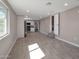 Bright living room with recessed lighting and an attached kitchen featuring stainless steel appliances at 358 N 82Nd Way, Mesa, AZ 85207