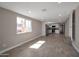 Bright living room with wood-look floors and seamless transition to the kitchen at 358 N 82Nd Way, Mesa, AZ 85207