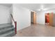 Finished basement space with a wood staircase and door to another room at 414 N Horne --, Mesa, AZ 85203