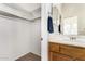 Bright bathroom featuring dual mirrors and cabinets at 42017 N Crooked Stick Rd, Anthem, AZ 85086