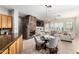 Open-concept dining area with fireplace and seamless flow into the living spaces at 42017 N Crooked Stick Rd, Anthem, AZ 85086