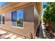Side of house featuring window with backyard view at 42017 N Crooked Stick Rd, Anthem, AZ 85086