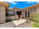 Charming front entrance featuring desert landscaping, a secure gate, and a well-maintained walkway at 42017 N Crooked Stick Rd, Anthem, AZ 85086