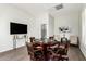 Well-lit game room with a poker table, comfortable chairs, and a sleek television at 42017 N Crooked Stick Rd, Anthem, AZ 85086
