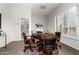 Inviting game room features a poker table, comfortable chairs, and a convenient half bathroom at 42017 N Crooked Stick Rd, Anthem, AZ 85086