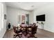 Bright game room featuring a poker table, comfortable seating, and a view of the outdoor patio at 42017 N Crooked Stick Rd, Anthem, AZ 85086