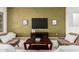 Stylish living room features a TV, modern decor, neutral walls, and comfortable seating at 42017 N Crooked Stick Rd, Anthem, AZ 85086