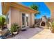 Cozy outdoor patio with stone flooring and fireplace perfect for entertaining at 42017 N Crooked Stick Rd, Anthem, AZ 85086