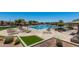 Beautiful community pool featuring a large pool, lounge chairs, and shaded cabanas for relaxing by the pool at 42017 N Crooked Stick Rd, Anthem, AZ 85086