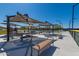 Community pickleball courts with shaded picnic tables, ideal for friendly competition at 42017 N Crooked Stick Rd, Anthem, AZ 85086